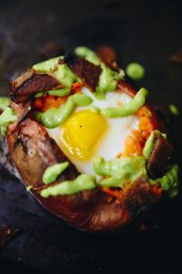  Sweet Potato Egg Boats with Avocado Crema and Bacon 